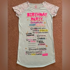 Justice, girls size 16/18, main color is light blue, with pink, yellows, purple